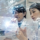 Two scientists working in the lab with stylized graphics.