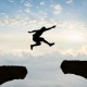 A person jumping across a void.